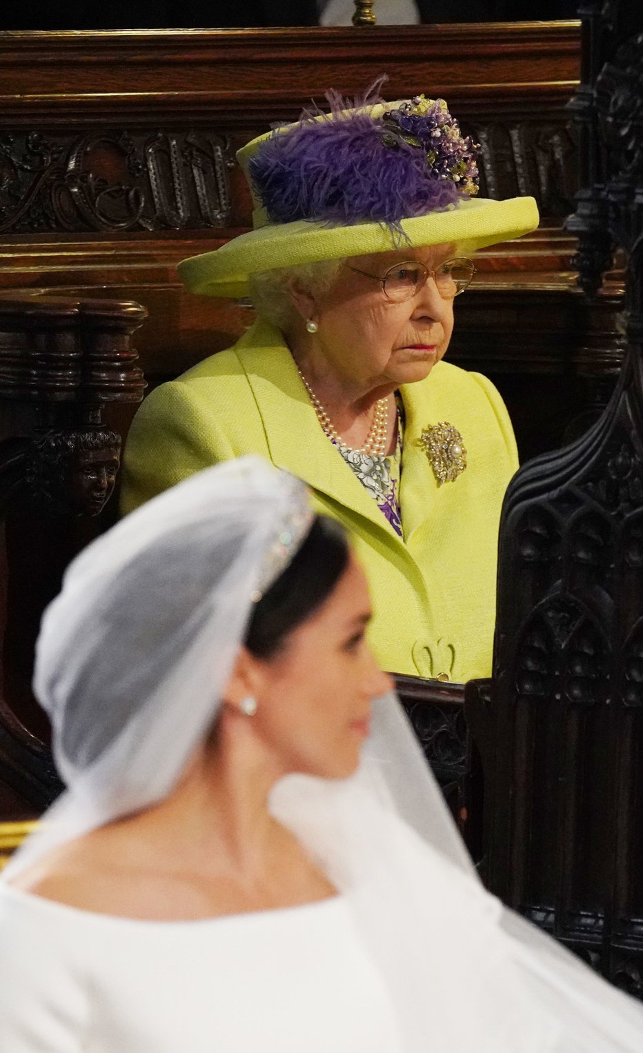 Fotografija: Kraljica Elizabeta II. je prišla na poroko Harryja in Meghan, čeprav je bila Meghan v preteklosti že poročena. FOTO: AFP