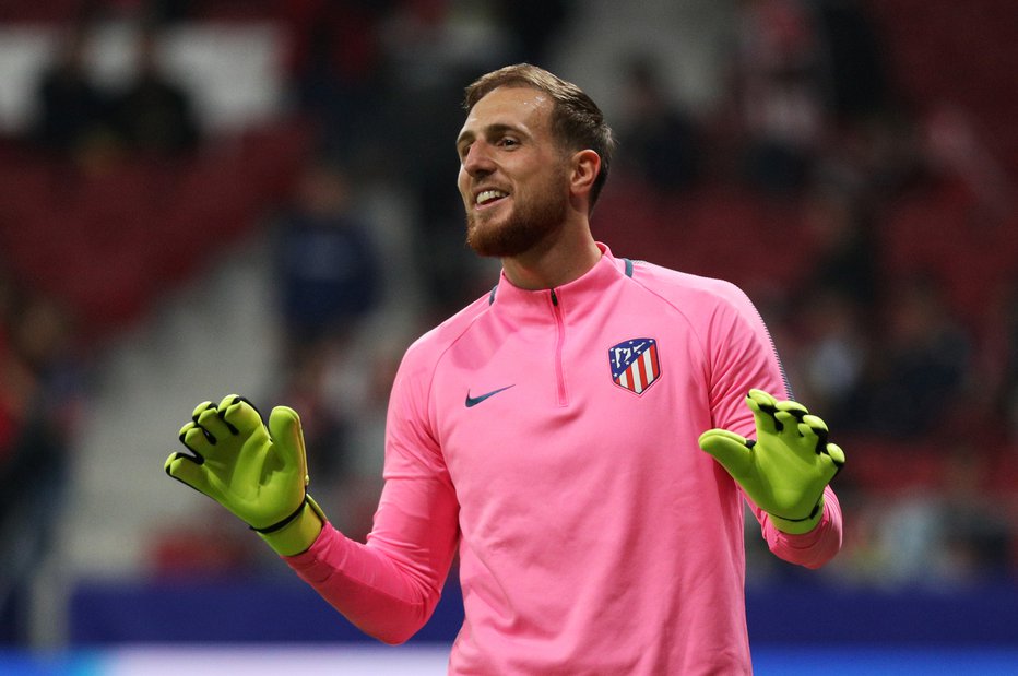 Fotografija: Jan Oblak bo poskušal ustaviti napade madridskega Reala. FOTO: Reuters