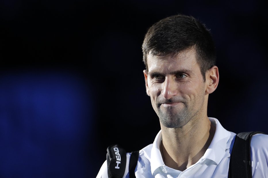 Fotografija: Nole naj bi ali pa ne zaigral v Melbournu. FOTO: Guglielmo Mangiapane/Reuters
