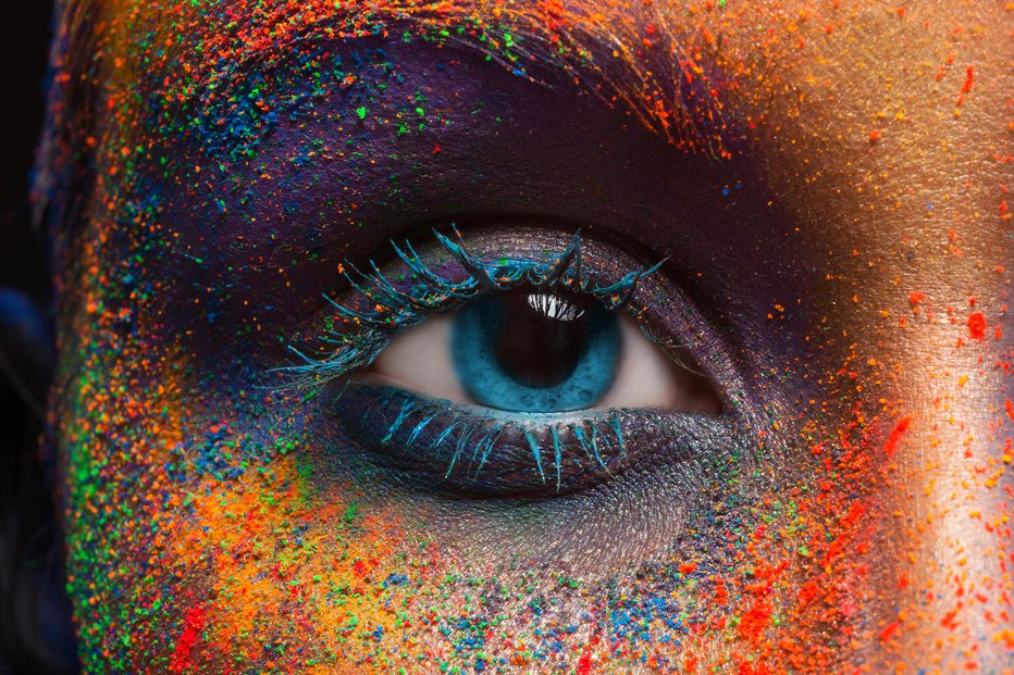 Fotografija: Crop of female eye with colorful make up. Beautiful fashion model with creative art makeup. Abstract colourful splash make-up. Holi festival