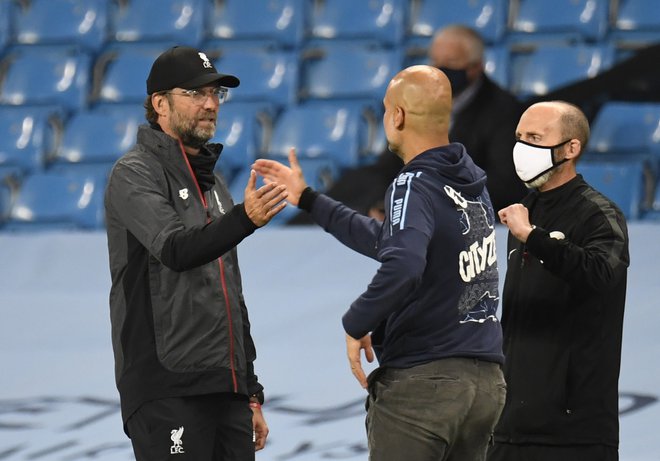 Jürgen Klopp in Pep Guardiola sta velika tekmeca, a se tudi zelo spoštujeta. FOTO: Peter Powell/Reuters