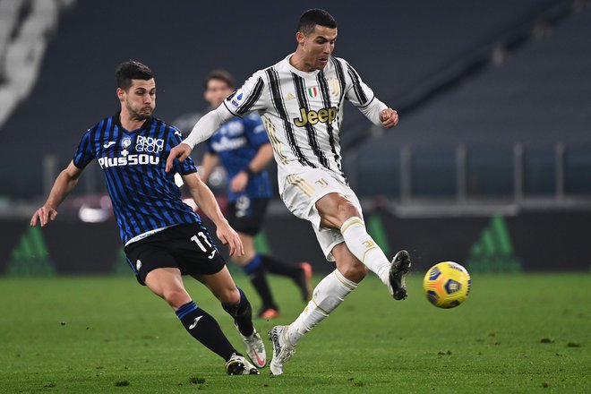 Cristiano Ronaldo je zastreljal 11-metrovko. FOTO: Marco Bertorello/AFP