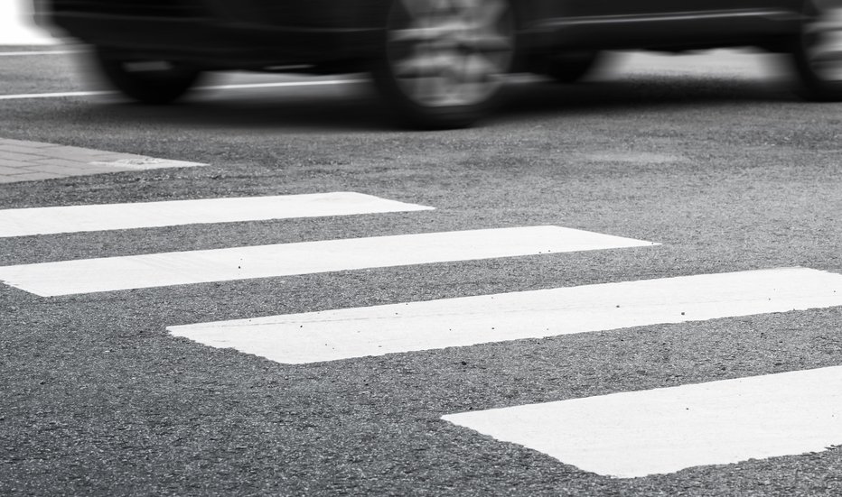 Fotografija: Pedestrian crossing road marking and fast moving car, photo with selective focus and shallow DOF FOTO: Eugenesergeev Getty Images/istockphoto