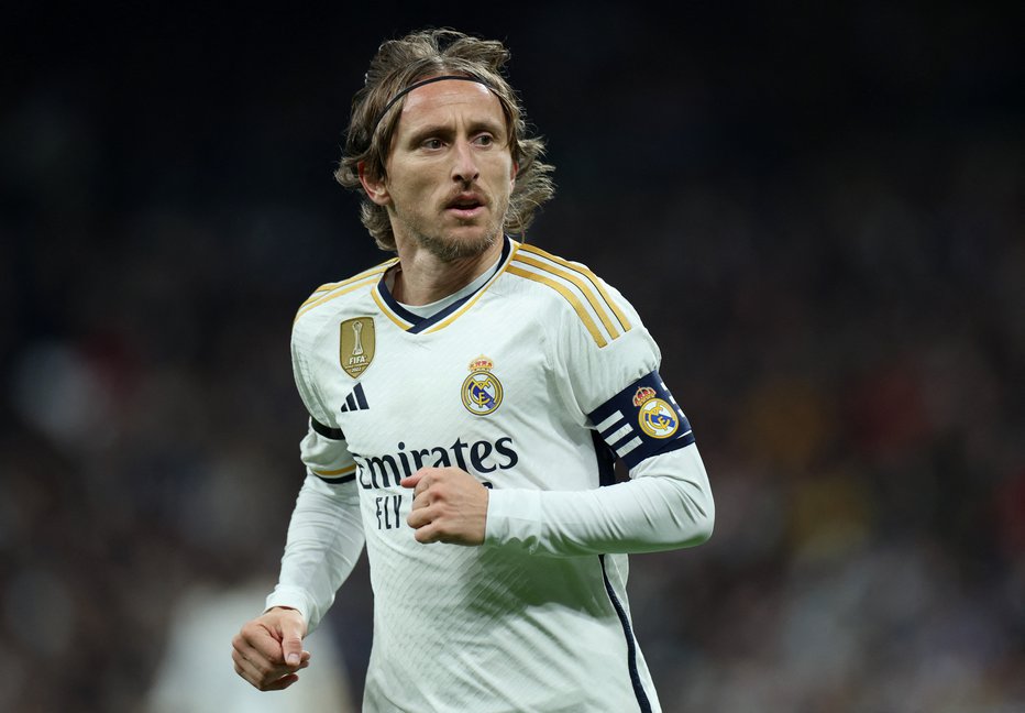 Fotografija: Luka Modrić ima težke spomine na mladost. FOTO: Isabel Infantes/Reuters