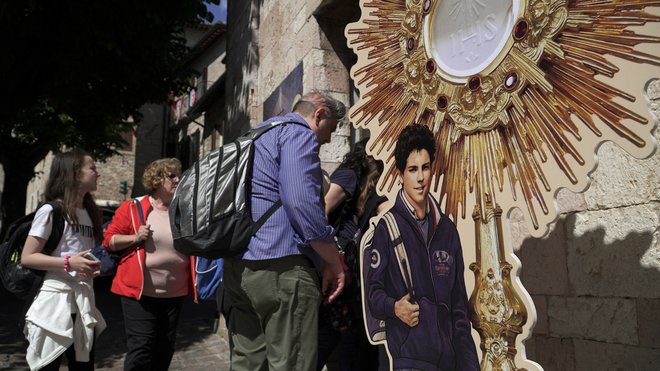 Njegova grobnica je v italijanskem kraju Assisi. FOTO: Matteo Berlenga/Reuters