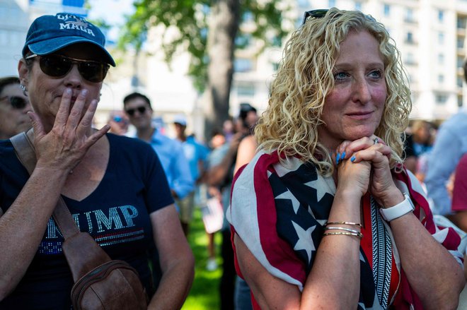 Trumpovi podporniki med molitvijo za svojega kandidata. FOTO: Spencer Platt Getty Images Via Afp