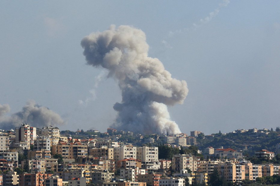 Fotografija: Ubitih je bilo 100 ljudi, več kot 400 pa ranjenih. FOTO: Mahmoud Zayyat Afp