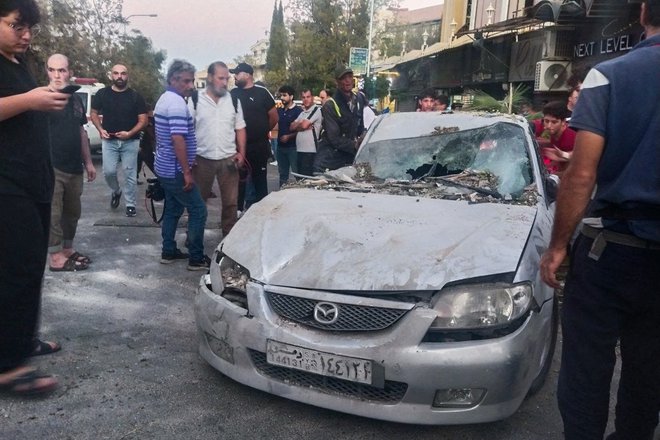 Damask, 2. oktobra, po izraelskem napadu na stanovanjsko zgradbo. FOTO: - Afp