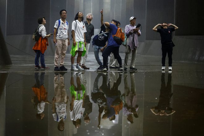 Tokijska katedrala je tudi turistična zanimivost. FOTO: Issei Kato/Reuters