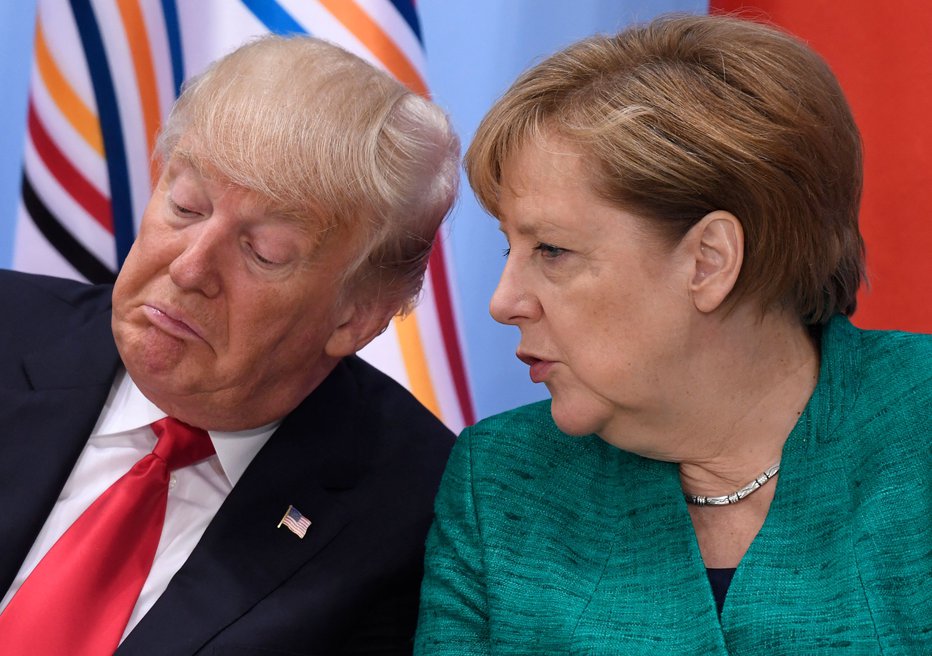 Fotografija: Donald Trump in nekdanja nemška kanclerka Angela Merkel FOTO: Saul Loeb/Afp